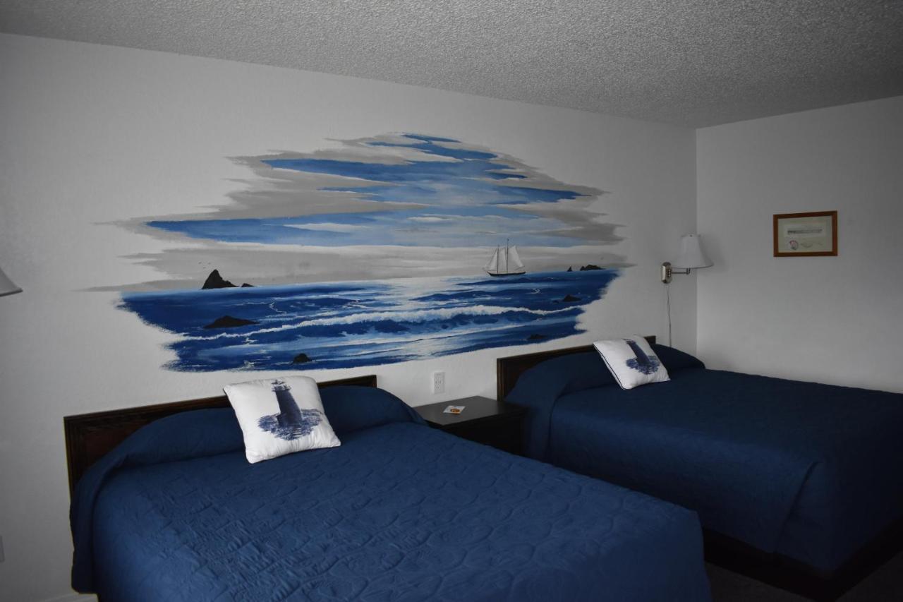 Lighthouse Cove Inn Bandon Exterior foto A room at the motel